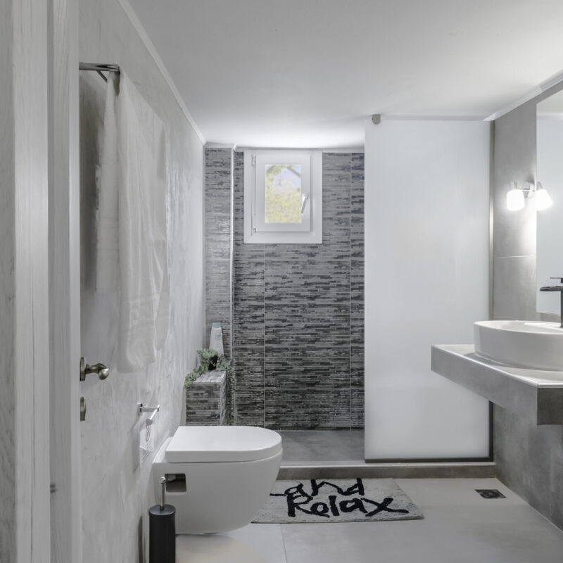 Inviting Bathroom Retreat in Margio Bay Large Mirror and Clean, Contemporary Lines