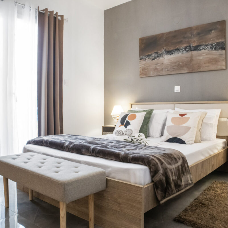 brown tones Relax in Modern Comfort thassos rental Cozy Bedroom with Decor and Art