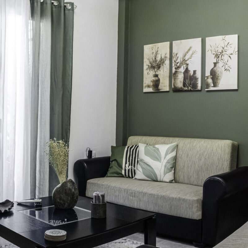 olive tones Chic Living Area at Margio Bay with Cozy Seating and Artistic Decor